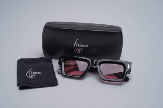 trimm life gladwin sunglasses with black frame and rose colored lenses case and cleaning cloth included